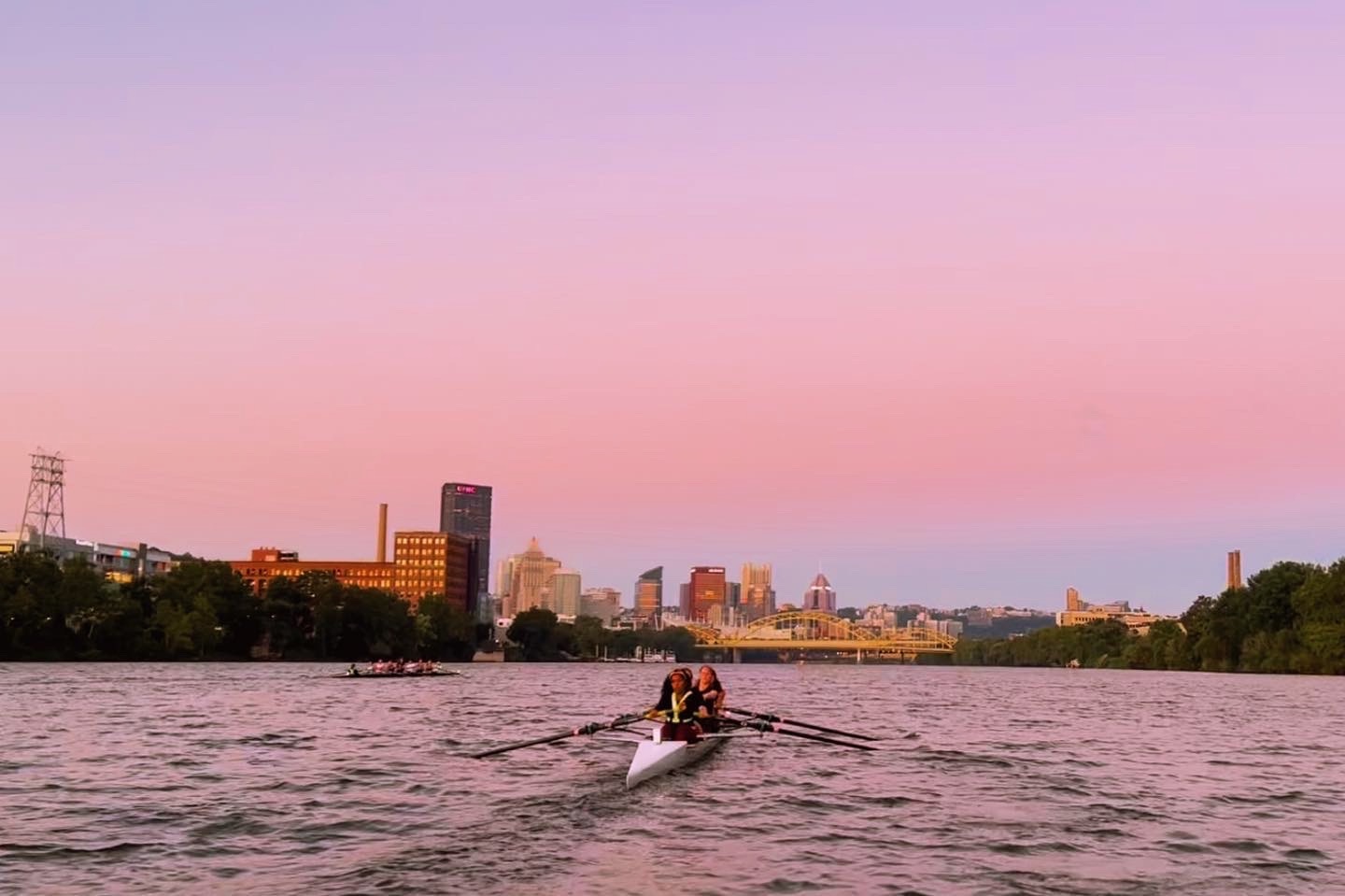 image of my team rowing with the sunrise